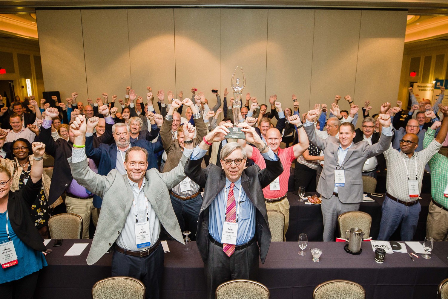 Reaching for the stars:  SNPA members raise their arms with Mayborn Award recipient Tom Silvestri in salute and celebration of our industry.